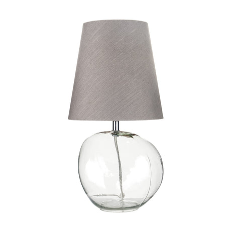Hallie Table Lamp, 43cm, with a round clear glass base and tapered grey linen shade, shown on a plain white background.
