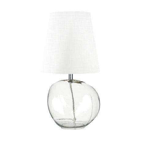 Hallie table lamp with a round clear glass base and tapered white fabric shade, shown on a plain white background.