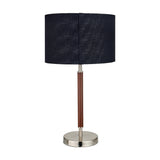 Gianni table lamp, 57cm, with a wood-effect stem and brushed silver base, topped by a black textured fabric drum shade, on a plain white background.