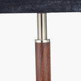 Gianni Table Lamp close-up showing the brushed silver neck joint above a wood-effect base, paired with a dark grey linen shade, on a plain background.