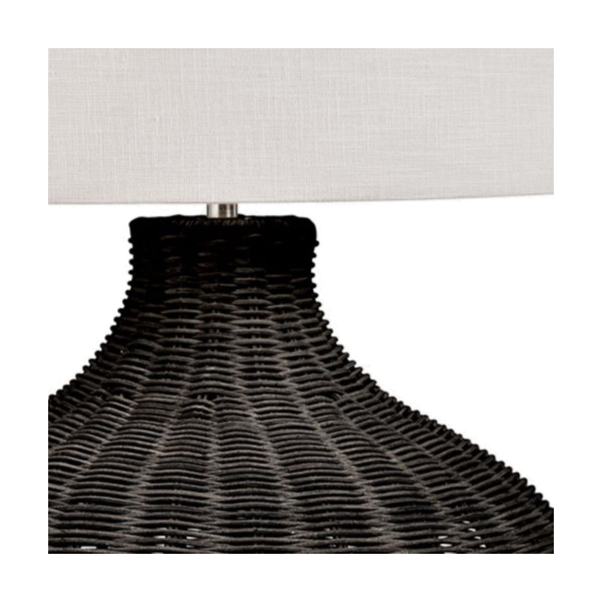 Close-up of the Allona Black Rattan Table Lamp base, showing woven black rattan texture beneath a white linen drum shade on a plain background.