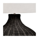 Close-up of the Allona Black Rattan Table Lamp base, showing woven black rattan texture beneath a white linen drum shade on a plain background.