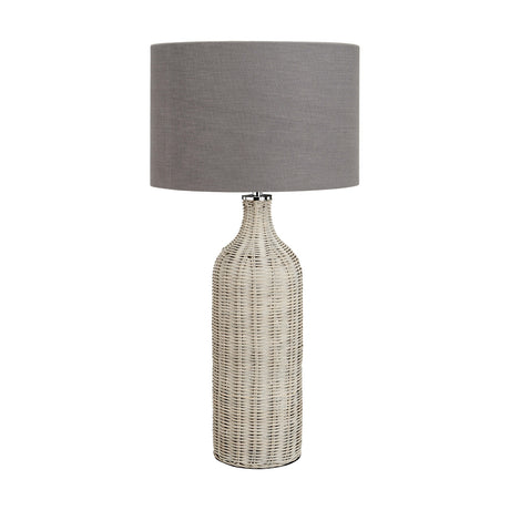 Anika Grey Wash Rattan Bottle Table Lamp, 62cm tall with a woven rattan base and grey drum fabric shade, shown on a plain white background.