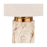 Carrara Stone Effect Ceramic Tall Table Lamp with a marble-look base, brass-tone collar, and cream linen drum shade, shown close-up on a white background.