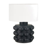 Serenity Black Bobbled Ceramic Large Table Lamp with a white drum shade, showcasing a matte black textured base and round bobble detailing, set against a plain white background.