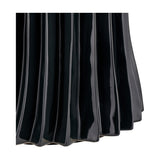 Close-up of the Devony Black Pleated Ceramic Table Lamp Base, showing ridged, wave-like fluted texture in a glossy black ceramic finish against a white background.