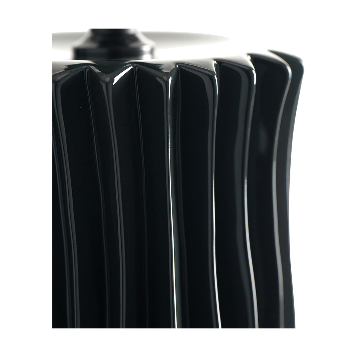 Close-up of the Devony Black Pleated Ceramic Table Lamp Base, 38cm, showing vertical ribbed detailing and glossy black finish against a white background.