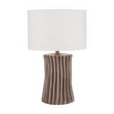 Devony Taupe Pleated Ceramic Table Lamp with fluted ridged base and white drum shade, brass detailing, on a plain white background.