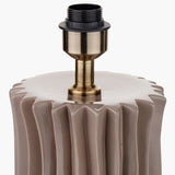 Close-up of the Devony Taupe Pleated Ceramic Table Lamp Base, showing the fluted taupe ceramic top with antique brass fitting and E27 lamp holder on a plain background.
