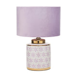 Thea Lilac & Gold Leaf ceramic table lamp with a floral patterned base, gold trim, and a plain lilac drum shade, shown on a white background.