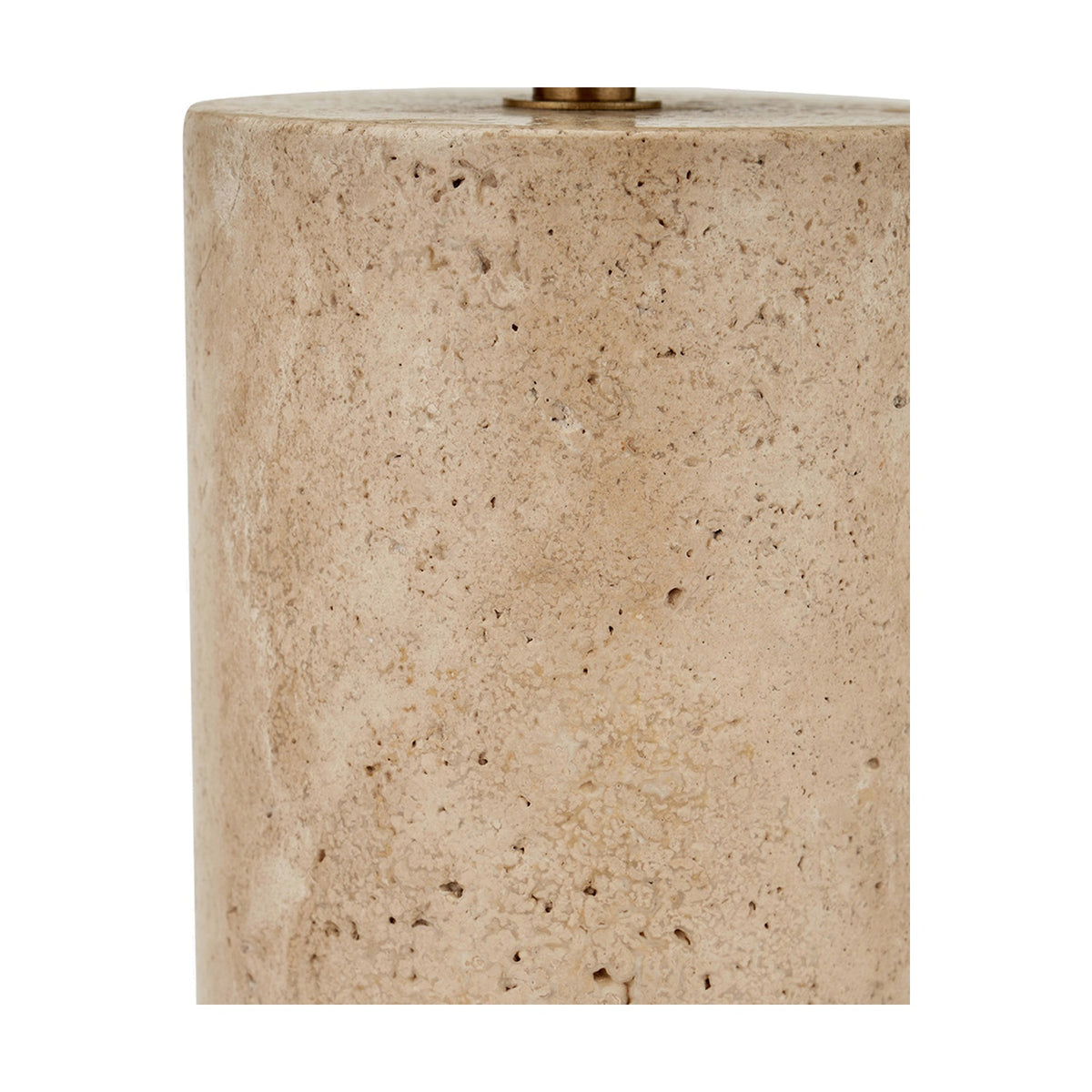 Close-up of the Kanoa Limestone Cylinder Table Lamp base, showing a textured natural stone surface with a brass fitting at the top edge.