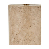 Close-up of the Kanoa Limestone Cylinder Table Lamp base, showing a textured natural stone surface with a brass fitting at the top edge.