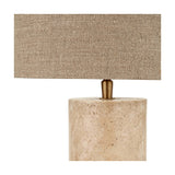 Kanoa Limestone Cylinder Table Lamp with a rectangular linen shade and brass gallery detail atop a natural stone cylindrical base, shown on a plain white background.