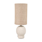 Althea Sandstone Table Lamp, 48cm, with a round sand-coloured stone base and tall cylindrical natural linen shade, shown on a plain white background.