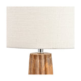 Close-up of the Draydon Mango Textured Cone Table Lamp showing a ridged natural wood cone base with chrome fitting beneath a cream linen drum shade.