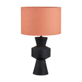 Koa Black Mango table lamp with a sculpted geometric wood base and coral drum shade, shown on a plain white background.