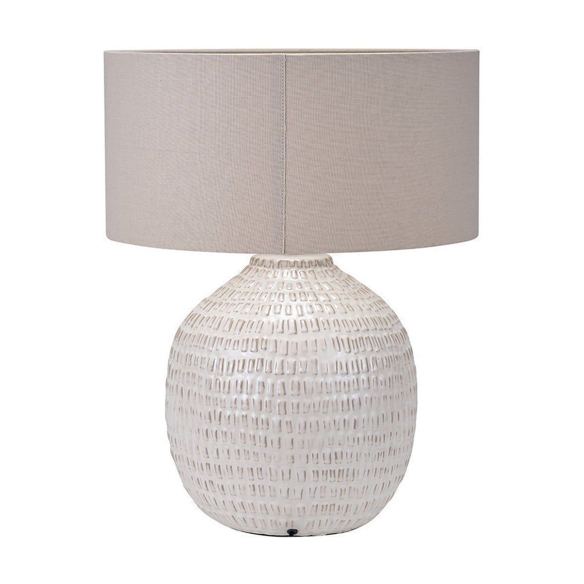 Signe Warm White table lamp with a textured ceramic base and a linen drum shade, shown on a plain white background.