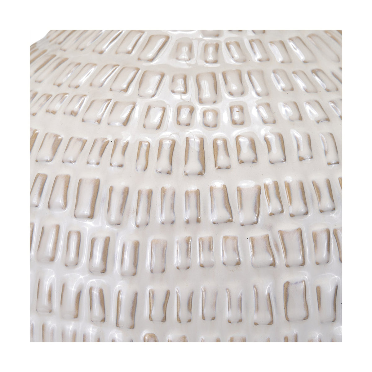 Close-up of the Signe warm white ceramic table lamp base, showing a textured linear ridge pattern in a glossy glazed finish.