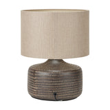 Kai Earth Brown Textured Ceramic Table Lamp, 34cm, with a ridged brown ceramic base and a beige linen drum shade, shown on a plain white background.