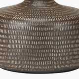 Close-up of the Kai Earth Brown Textured Ceramic Table Lamp base, showing a dotted dash pattern in cream on a matte brown ceramic surface.