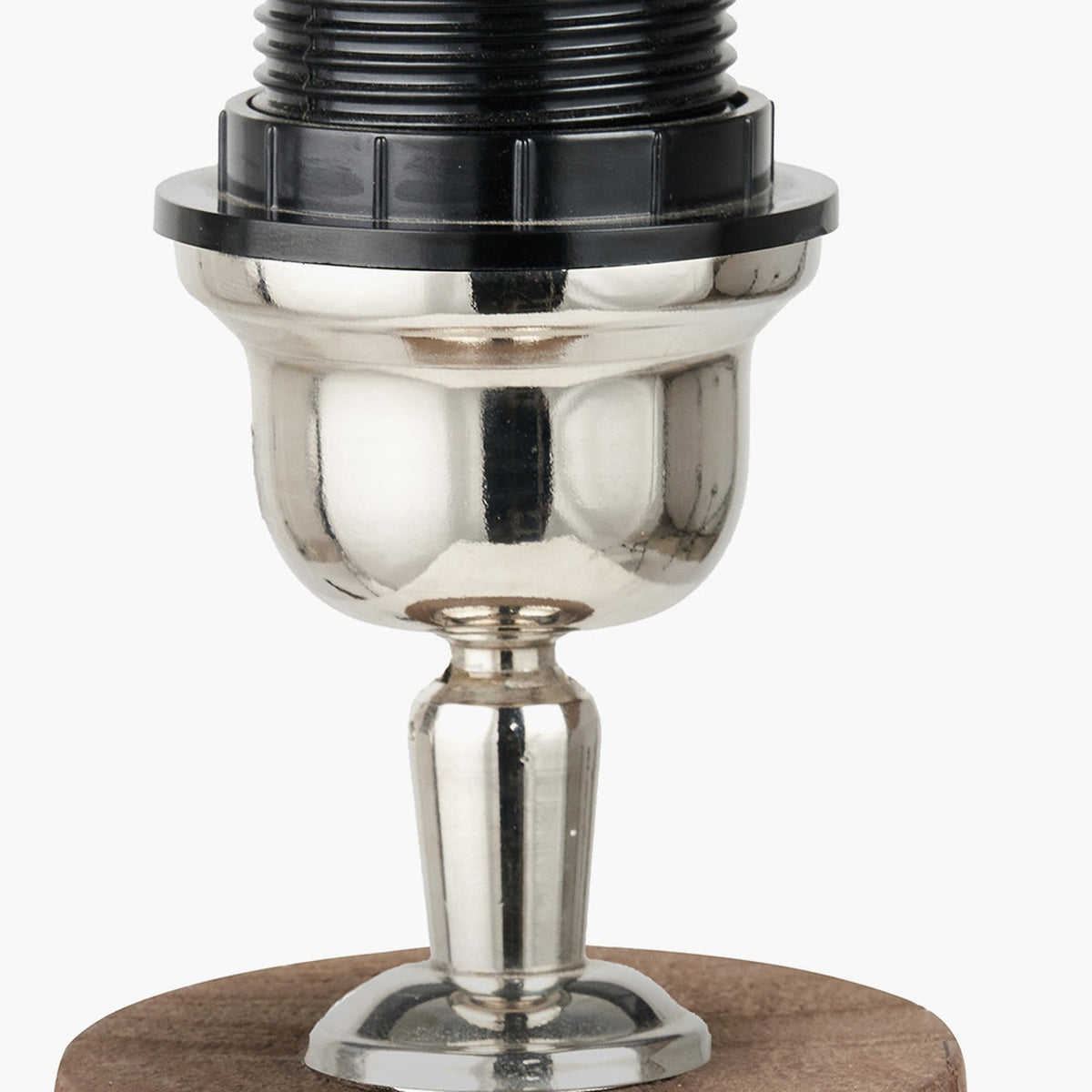 Esha Conical Wood Table Lamp Base close-up showing polished silver-tone urn and pedestal stem on a wooden disc base, with black threaded socket fitting, on a plain background.