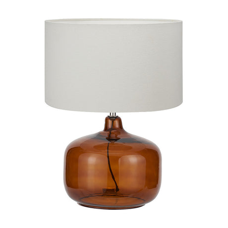 Corby table lamp with a rounded amber glass base and white handloom cylinder shade, 58cm tall, shown on a plain white background.