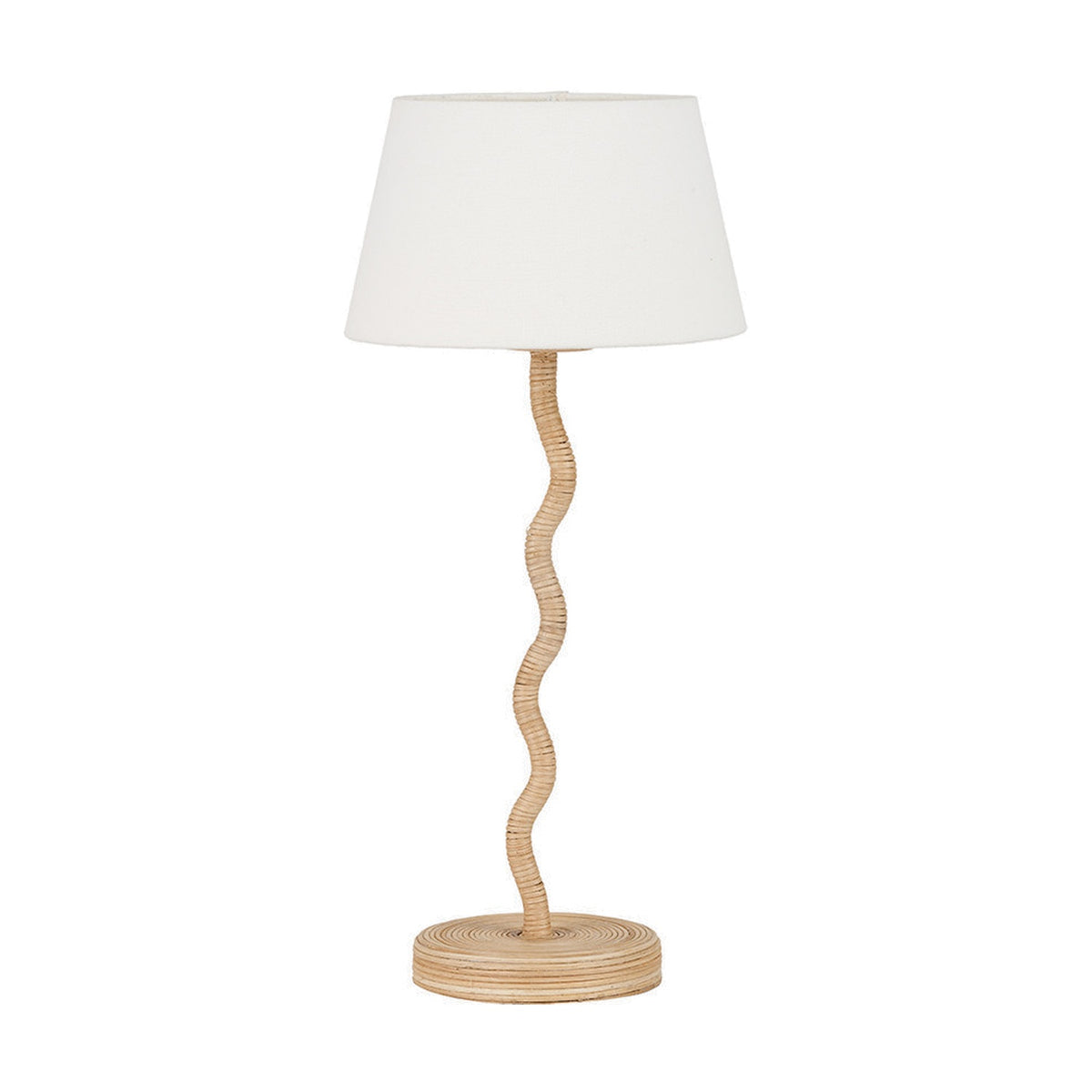 Palau Rattan Wave Table Lamp with a white tapered fabric shade on a wavy natural rattan stem and round rattan base, shown on a plain white background.
