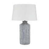 Bude Blue & White Stripe Stoneware Table Lamp with a tapered white fabric shade, ceramic base in vertical blue and white stripes, shown on a plain white background.