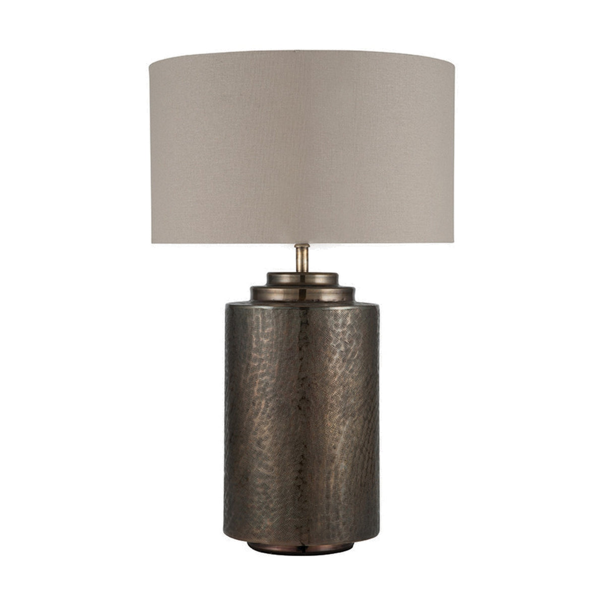 Zuri Large Table Lamp with textured antique brass cylindrical base and drum lampshade in light grey fabric, shown on a plain white background.