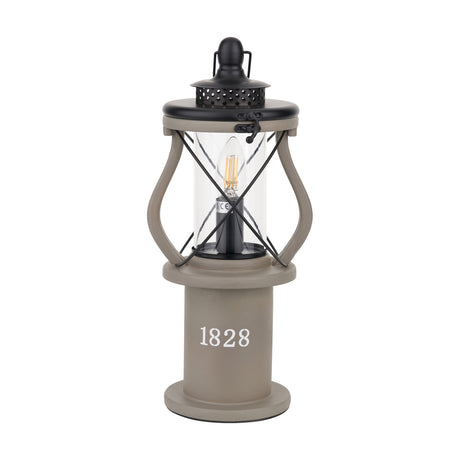 Gibson Antique Grey Lantern Table Lamp, 41cm, with black cage frame, glass cylinder shade, visible E14 LED bulb, and "1828" text on the grey base, shown on a white background.