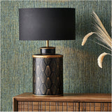 Chrysler Black Art Deco table lamp, 40cm, with gold fan-motif ceramic base and black rectangular shade, shown on a wooden sideboard against patterned wallpaper.