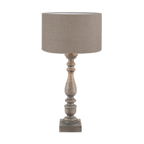 Alia table lamp with a turned mango wood base in grey wash finish and a grey linen cylinder shade, shown on a plain white background.