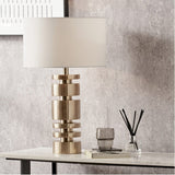 Elon Champagne Gold Metal Stacked Cylinder Table Lamp with Ivory Shade