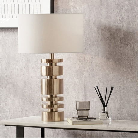 Elon Champagne Gold Metal Stacked Cylinder Table Lamp with Ivory Shade