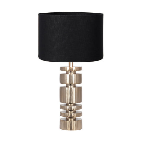 Elon table lamp with a stacked champagne gold metal cylinder base and a black self-lined linen drum shade, shown against a plain white background.