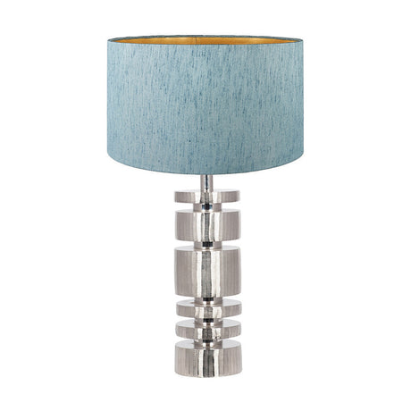 Elon table lamp with a silver metal stacked cylinder base and a duck egg blue drum shade with gold-tone interior, shown on a plain white background.