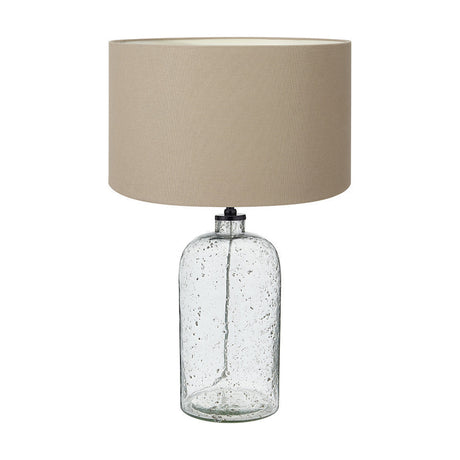 Ophelia table lamp with a bubble-textured clear glass base and a taupe handloom drum shade, shown on a plain white background.