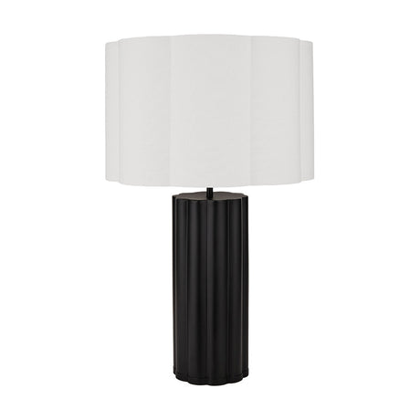 Petula table lamp with a black scalloped metal base and a white cylindrical fabric shade, shown on a plain white background.