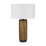 Aurelio table lamp with a textured brass cylindrical base and black trim, paired with a white drum shade, shown on a plain white background.