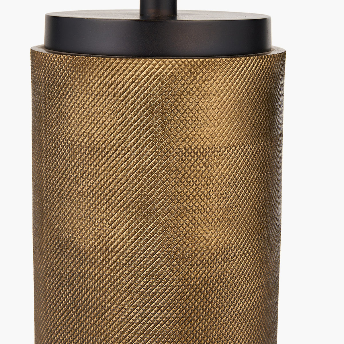 Close-up of the Aurelio Black Textured Table Lamp Base, 43cm, showing a knurled brass cylindrical body beneath a matte black cap fitting, on a plain white background.