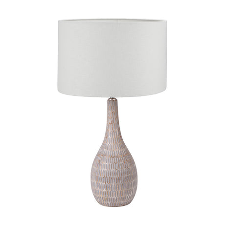Ioan Grey Engraved Wood Bottle Table Lamp with a textured grey base and white self-lined drum shade, shown on a plain white background.