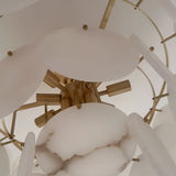 Close-up of the Solyra 6 Light 2 Tier Petal Alabaster Chandelier in Soft White, featuring round alabaster discs and gold rods arranged in a modern, layered pattern against a neutral backdrop.