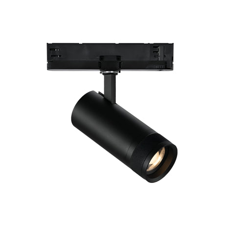 A sleek Solis Three Phase Dimmable LED Track Spotlight 15W 3000K in black, featuring a cylindrical design, is mounted on a black three-phase track component. Its adjustable light angles slightly downward, making it ideal for accent or spotlighting in various settings. The image is set against a white background.