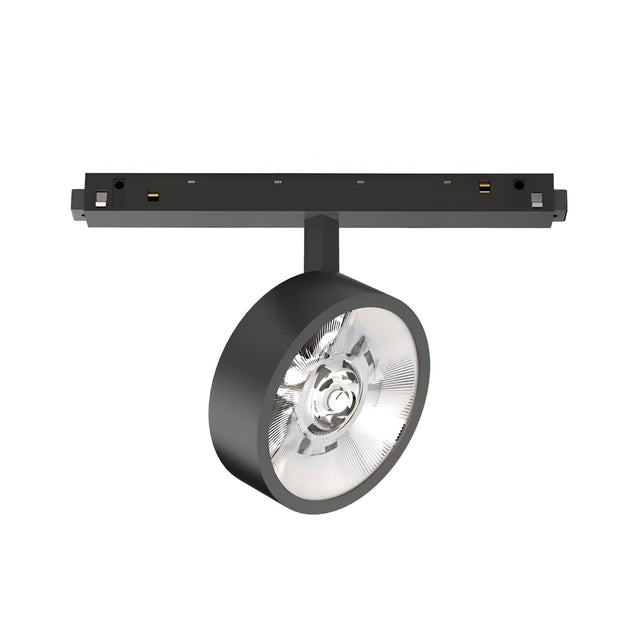 The Luxeon Dimmable LED Magnetic Track Spotlight 9W 3000K 1-10V in black features a round, transparent lens for precise directional lighting. Attached to a horizontal ceiling mount, its sleek modern design complements various interior spaces. With dimmable functionality and a warm 3000K glow, it creates the perfect ambiance.