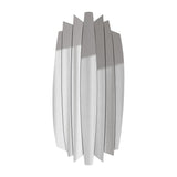 Full length mirror built from seven separate mirror blades set at different angles, an irregular outline on a plain background.