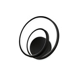 The Glistis Dimmable LED Wall Light - Black, 28W embodies minimalist, contemporary lighting design at its finest with two overlapping black circular rings featuring glowing white edges set against a pristine backdrop. Its modern and energy-efficient structure enhances any space.