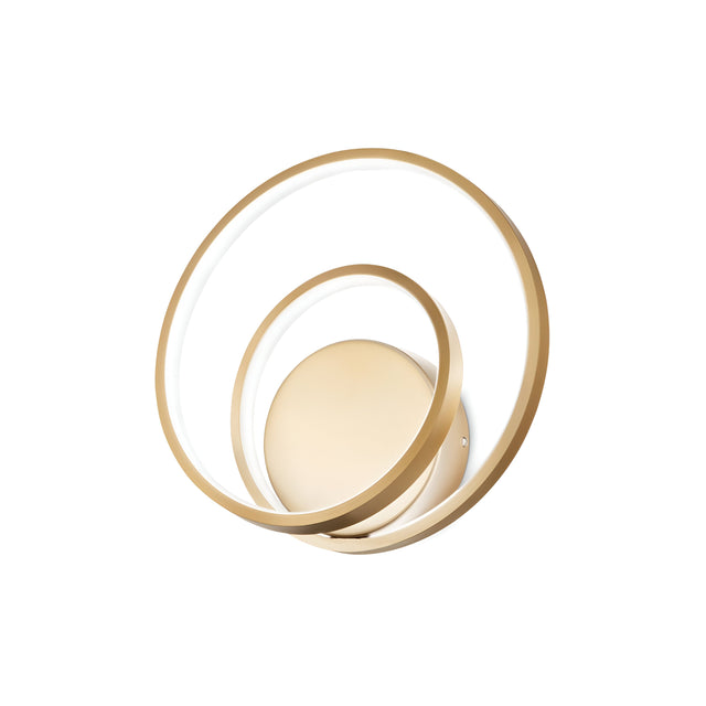 The Glistis Dimmable LED Wall Light - Brass, 28W boasts a minimalist design with gold and white circular elements featuring overlapping rings, complemented by a sleek brass finish. This piece utilizes 28W of energy-efficient LED technology to bring elegance and sophistication to any plain white background, offering both style and functionality.