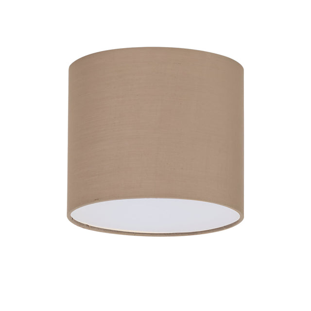The Aethera Cylinder Lampshade in dark beige is a smooth, fabric-covered piece with a cylindrical design. When viewed at an angle showcasing both the side and open bottom, its interior presents a pristine white surface.
