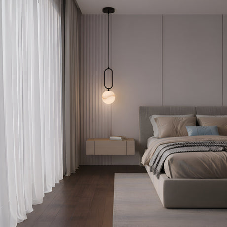 A modern, minimalist bedroom with a large bed, neutral bedding, floating nightstand, Orvyn 1 Light Small Globe Alabaster Single Pendant Light in soft white and matte black, sheer floor-to-ceiling curtains, and dark wooden floors.