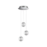 The Lustris 3 Light LED Cluster Pendant 16W 3000K in Silver boasts three spherical, textured glass shades with crystal-effect diffusers, suspended at different lengths from a round metallic base. Each globe provides an energy-efficient, soft glow for a stylish and elegant lighting solution.